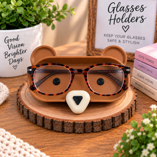 3D printed brown bear eyeglass holder with round ears and white nose displayed on rustic wood slice, handmade glasses stand desk organizer
