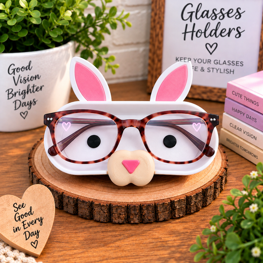 3D printed white bunny eyeglass holder with tall pink ears and pink nose on rustic wood slice, handmade rabbit glasses stand desk gift