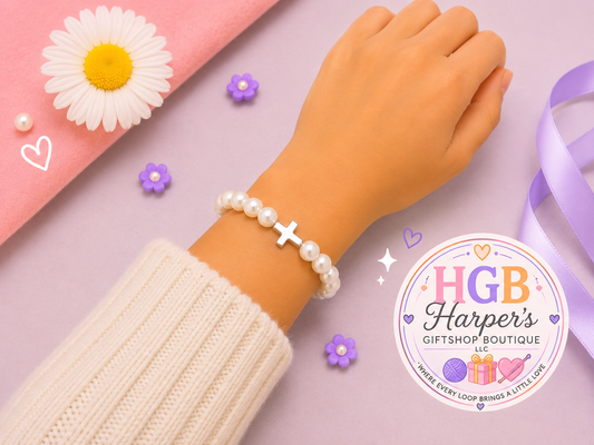 Handmade pearl and silver cross bracelet, Christian faith bracelet by Harper's GiftShop Boutique FLawton, OK

 Grace and Pearls silver cross pearl bracelet worn on wrist, elegant handmade Christian bracelet

Close-up of silver cross centerpiece surrounded by creamy white pearl beads, handmade faith bracelet

Pearl cross bracelet flat lay with floral accents, first communion baptism confirmation gift handmade jewelry