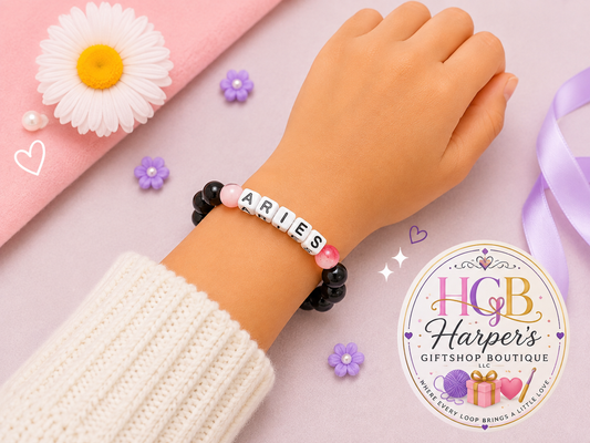 Handmade Aries zodiac letter bead bracelet with black beads and red accent beads by Harper's GiftShop Boutique Lawton, OK

Aries zodiac bracelet worn on wrist, handmade astrology letter bead bracelet gift for her

Close-up of ARIES letter beads with glossy black round beads and red accent beads, handmade zodiac bracelet

Aries zodiac bracelet flat lay, personalized astrology birthday gift handmade jewelry